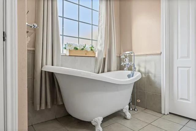 a bathroom with a sink and mirror with toilet