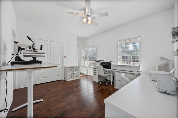 a kitchen with stainless steel appliances sink cabinets and wooden floor