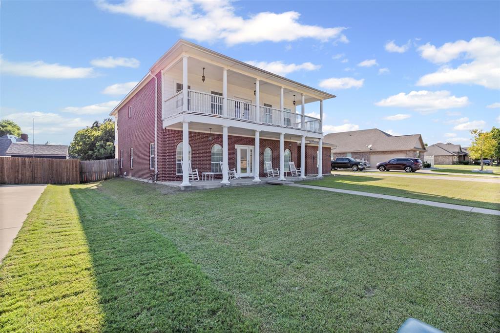 905 Royse Ridge Road Ennis, TX 75119 - Photo 3 of 38 a view of house with a yard