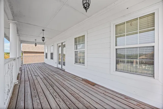 a view of a house with wooden floor and windows