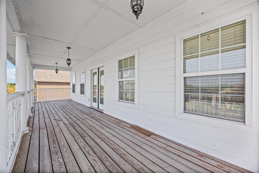 905 Royse Ridge Road Ennis, TX 75119 - Photo 35 of 38 a view of a house with wooden floor and windows