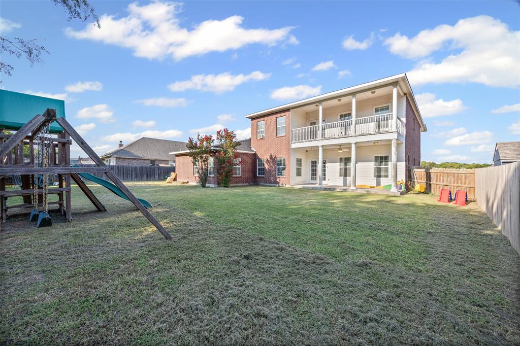 905 Royse Ridge Road Ennis, TX 75119 - Photo 36 of 38 a view of a house with a park