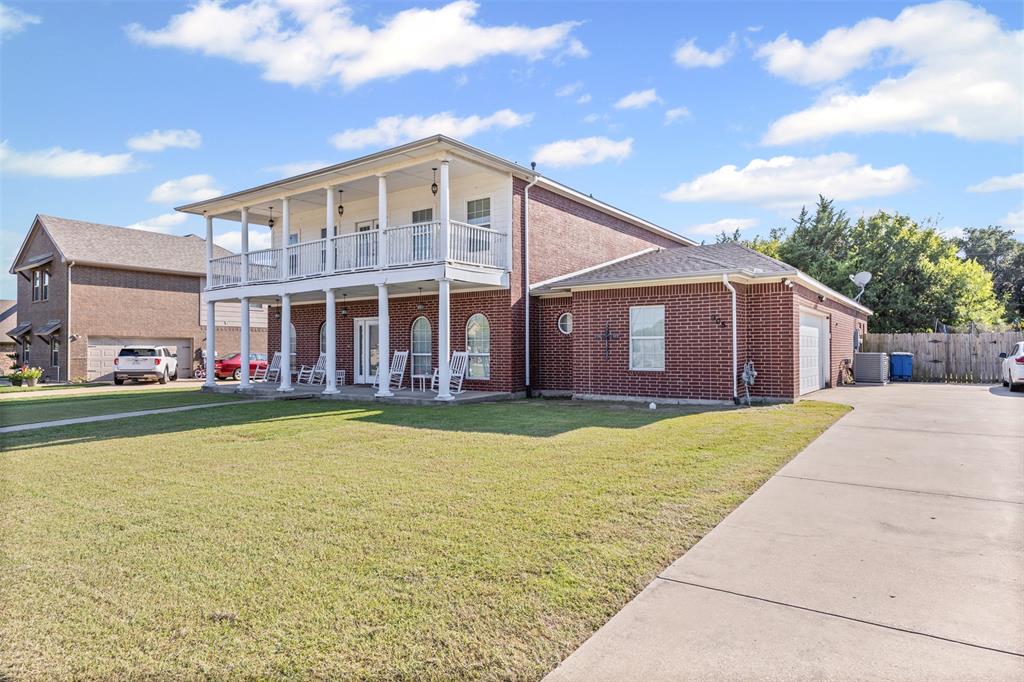 905 Royse Ridge Road Ennis, TX 75119 - Photo 4 of 38 a view of a house with swimming pool and a yard