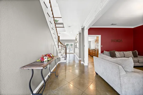 a living room with furniture a couch and wooden floor