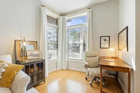 a workspace with furniture and a window