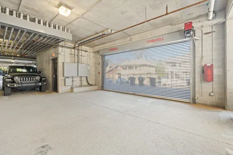 a view of an empty room with a hallway