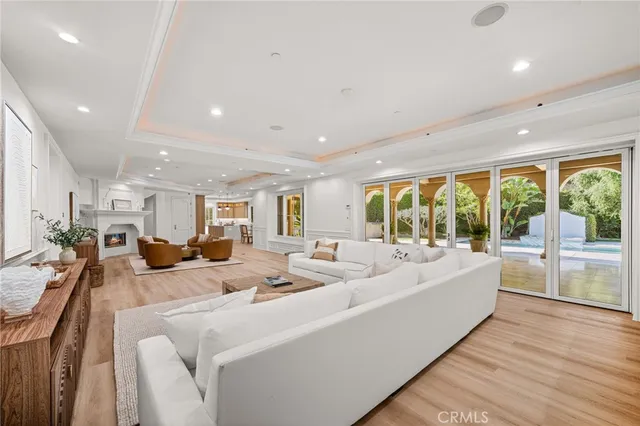 an entryway with wooden floor and windows