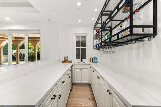 a view of a porch with a big yard and potted plants