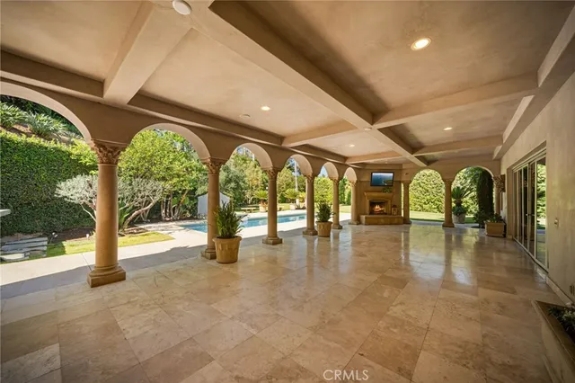 a view of an entryway with wooden floor and windows