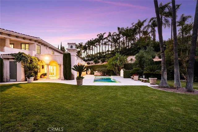 a large spacious bathroom with a large tub mirror and sink