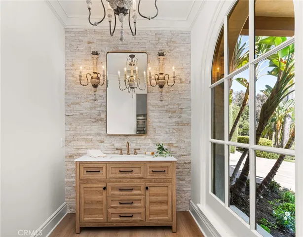 a living room with furniture fireplace and a large window