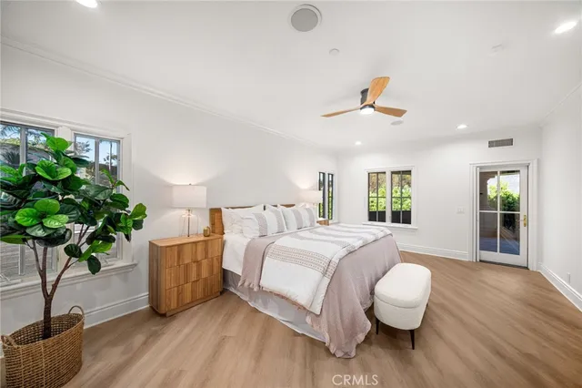a view of a room with wooden floor and window