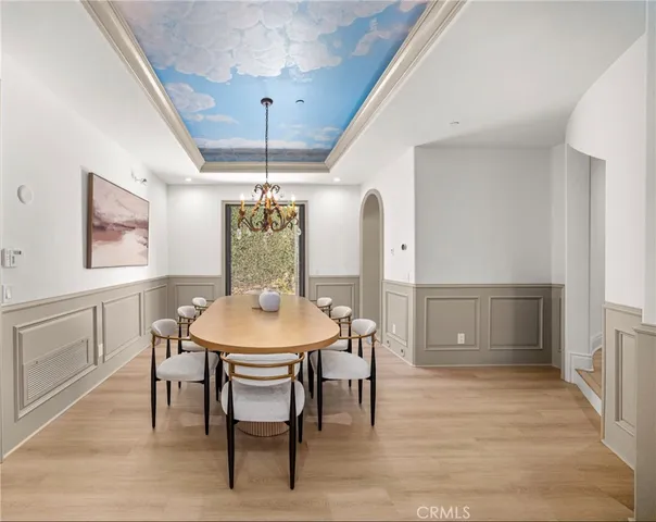 a living room with furniture a fireplace and a table