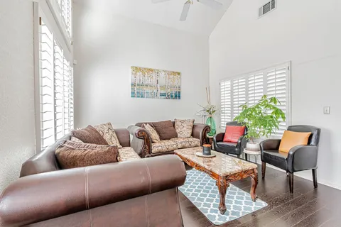 a living room with furniture and a window