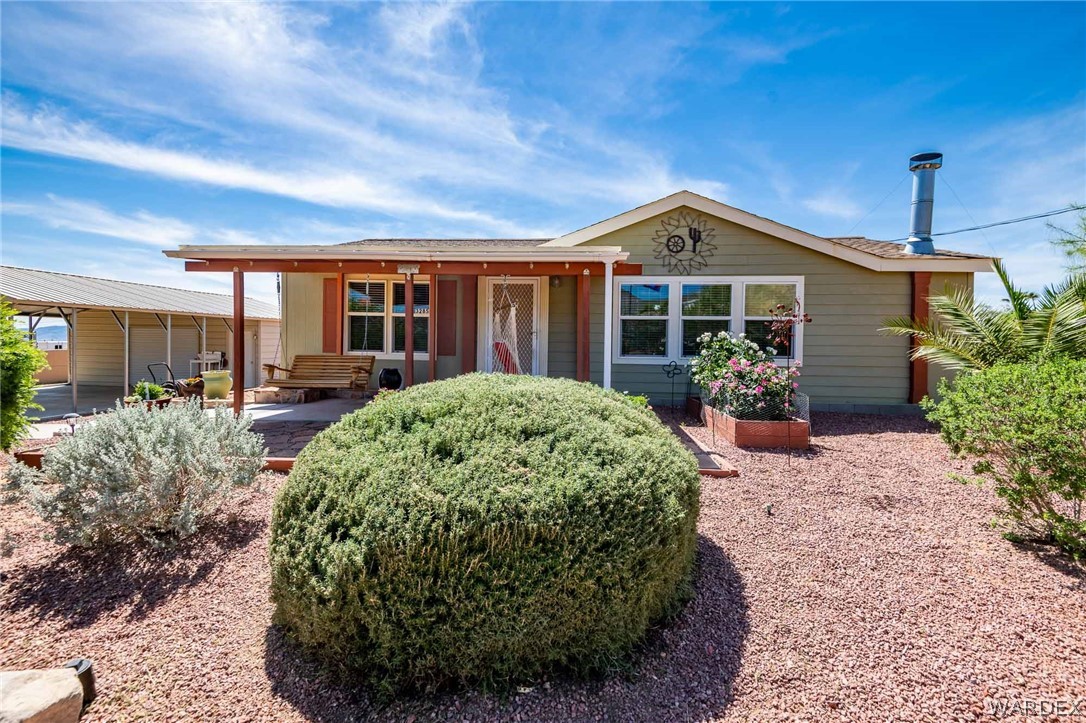 3285 Kelvin Road Golden Valley, AZ 86413 - Photo 1 of 43 a front view of a house with garden