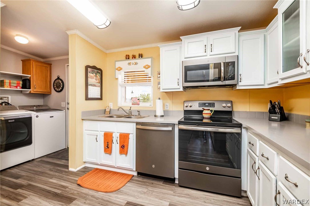3285 Kelvin Road Golden Valley, AZ 86413 - Photo 11 of 43 a kitchen with stainless steel appliances granite countertop a stove and a sink