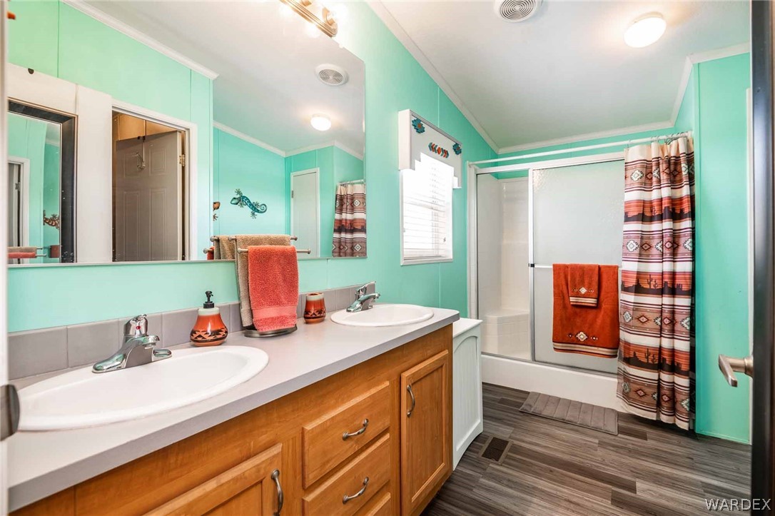 3285 Kelvin Road Golden Valley, AZ 86413 - Photo 20 of 43 a bathroom with a sink double vanity and a mirror