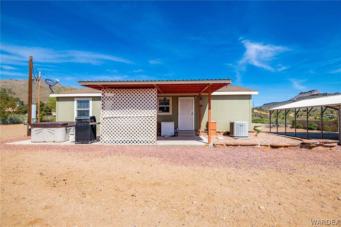 3285 Kelvin Road Golden Valley, AZ 86413 - Photo 2 of 43 a view of a house with a patio