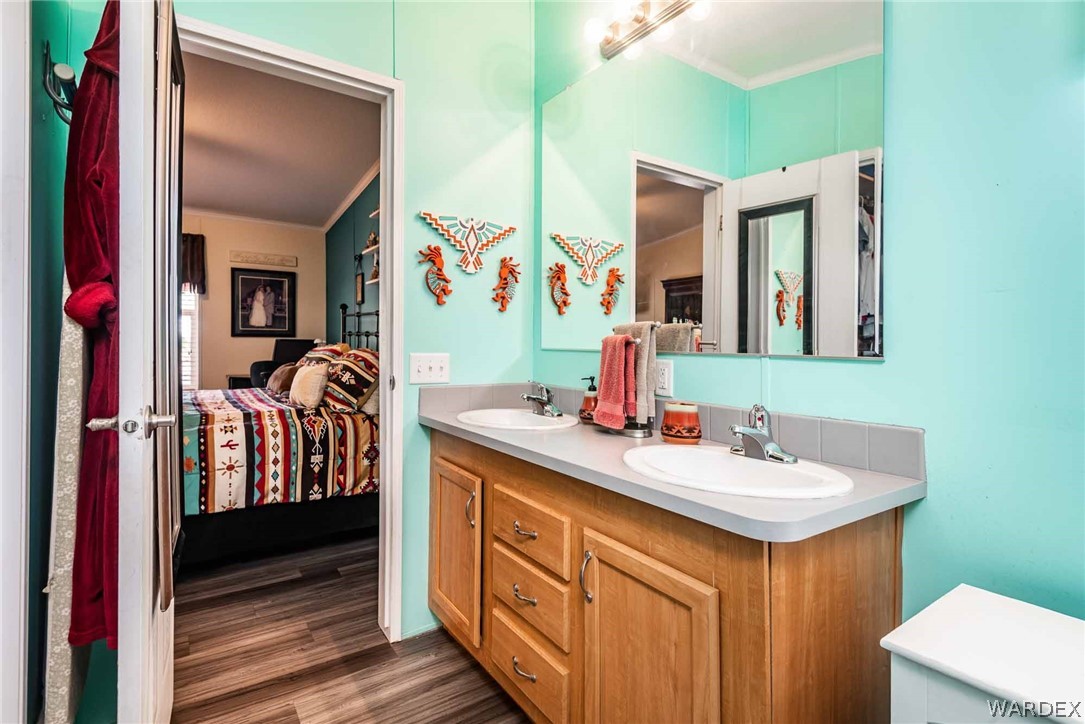 3285 Kelvin Road Golden Valley, AZ 86413 - Photo 21 of 43 a en suite bathroom with a double vanity sink and a mirror
