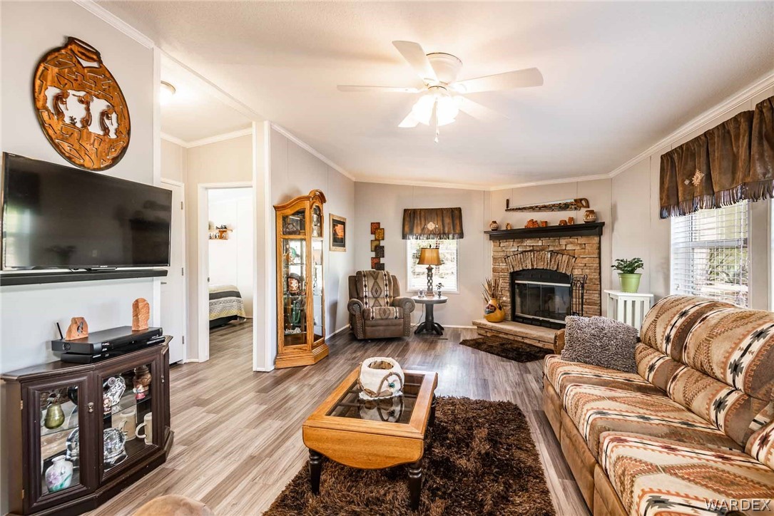3285 Kelvin Road Golden Valley, AZ 86413 - Photo 6 of 43 a living room with furniture and a flat screen tv