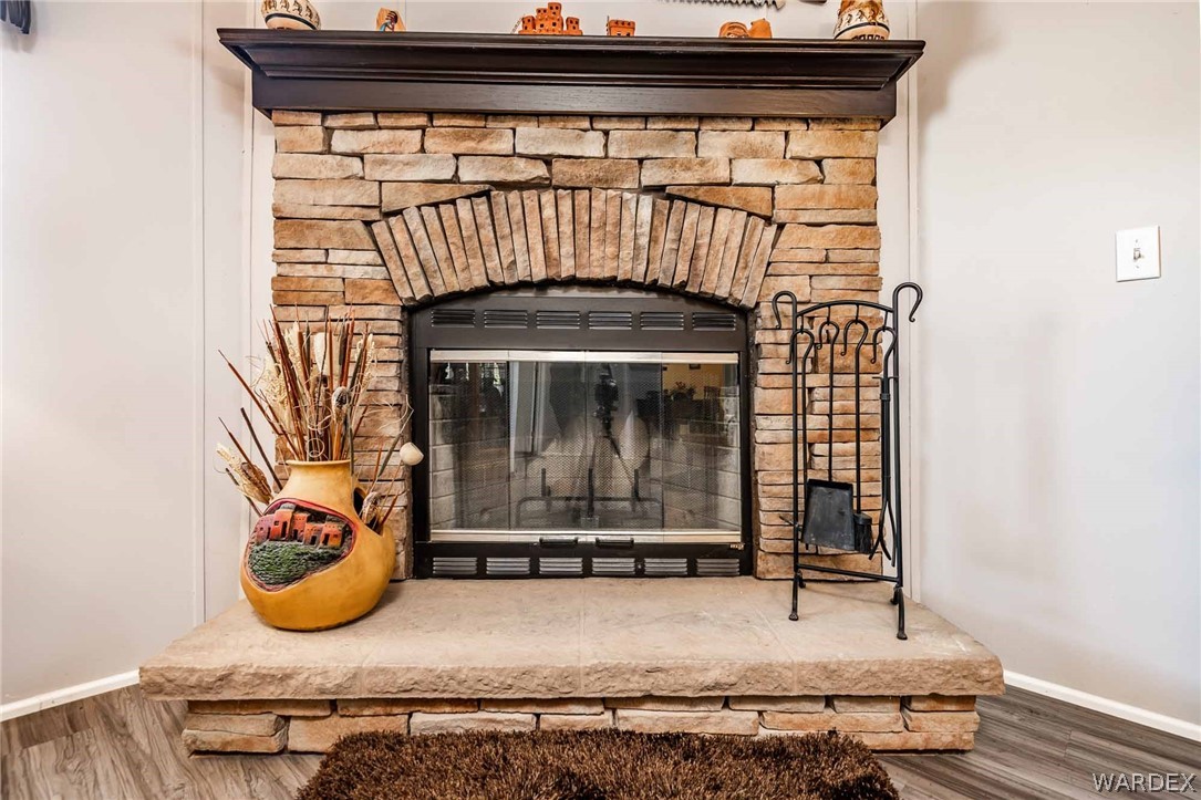 3285 Kelvin Road Golden Valley, AZ 86413 - Photo 8 of 43 a view of a fireplace with wooden floor