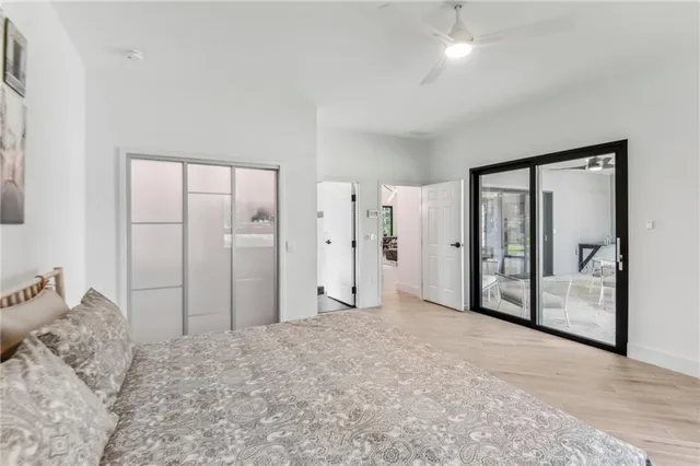 a view of a bedroom with closet and bathroom