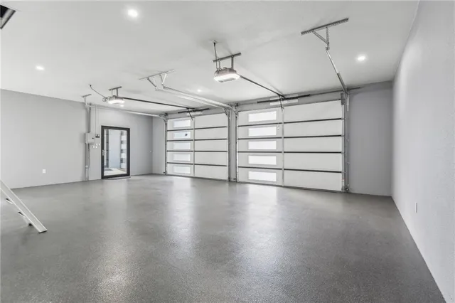 a view of a room with gym equipment and a window