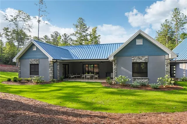 a front view of house with yard and green space