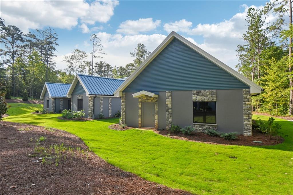 40 Red Oak Circle Buchanan, GA 30113 - Photo 36 of 39 a front view of house with yard and green space