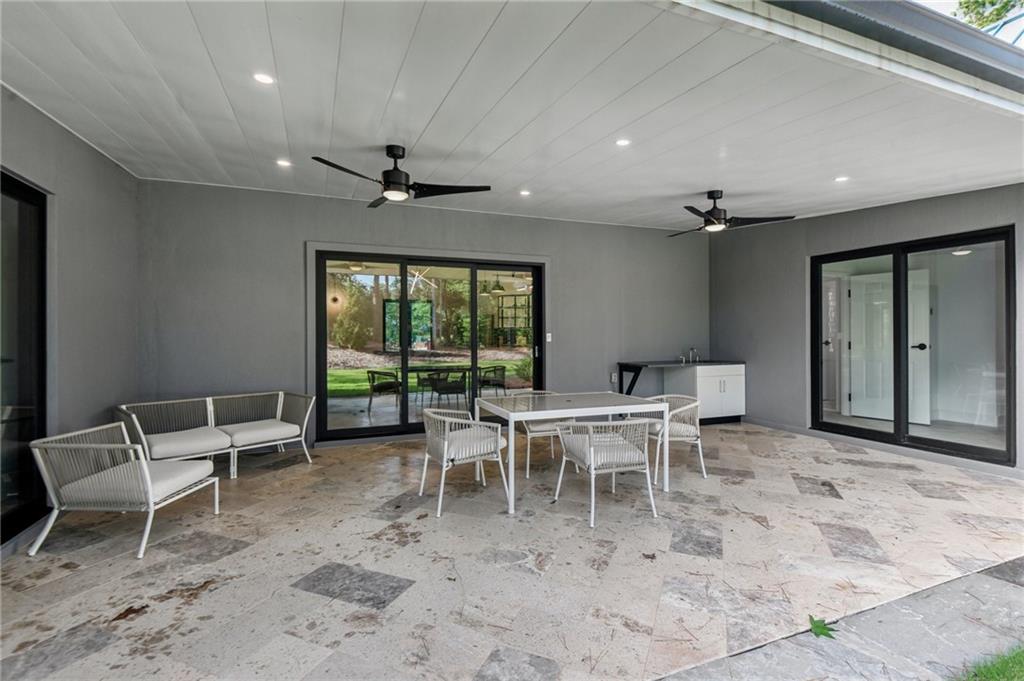 40 Red Oak Circle Buchanan, GA 30113 - Photo 38 of 39 a dining room with furniture a chandelier and a rug