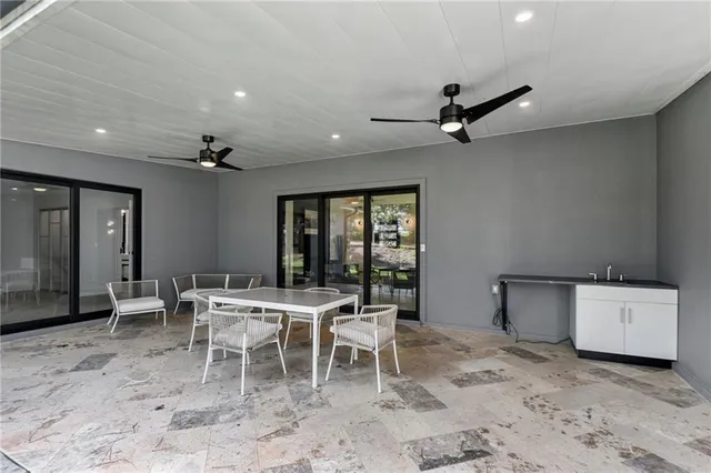 a dining room with furniture and window