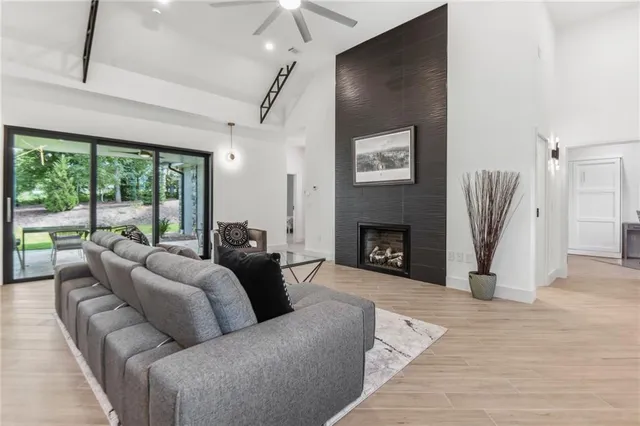 a living room with furniture window and a fireplace