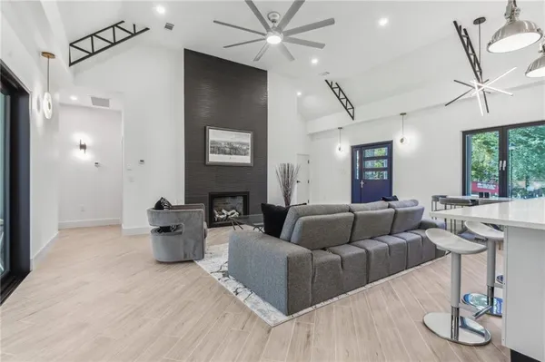 a living room with furniture and a large window