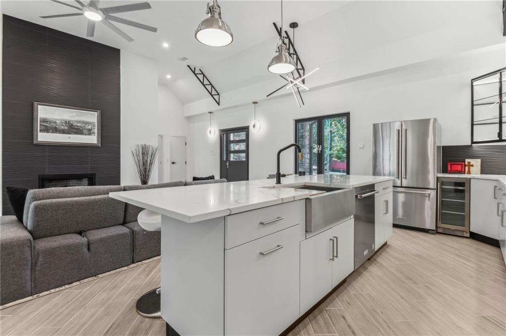 40 Red Oak Circle Buchanan, GA 30113 - Photo 10 of 39 a kitchen with stainless steel appliances kitchen island granite countertop a stove and a refrigerator