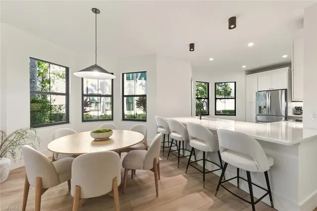 a view of a dining room with furniture window and outside view