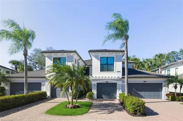 a front view of house with a garden