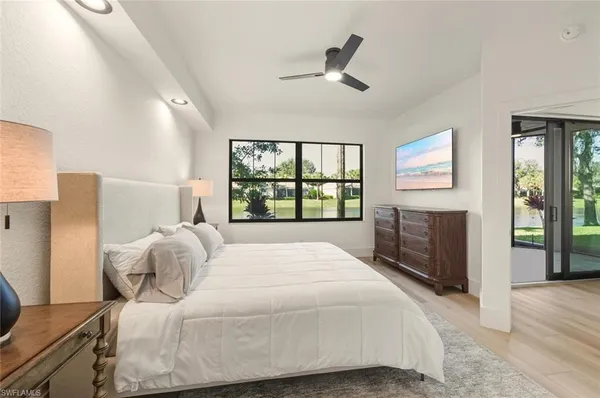a bedroom with a large bed and a window