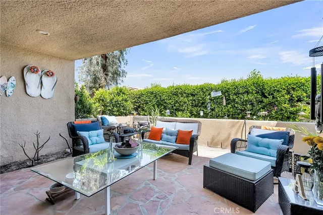 a outdoor living space with furniture and garden view