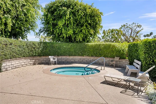 a view of swimming pool with a patio
