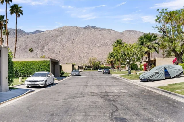 a view of car parked on the side of the road