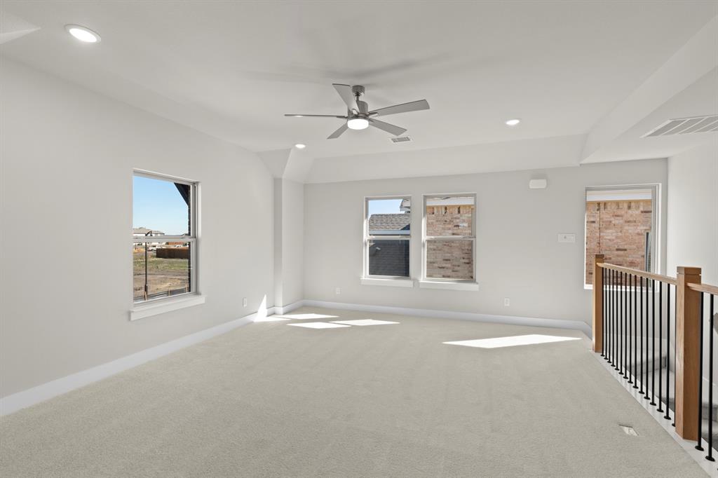 2359 Bell Way Forney, TX 75126 - Photo 24 of 31 an empty room with windows and fan