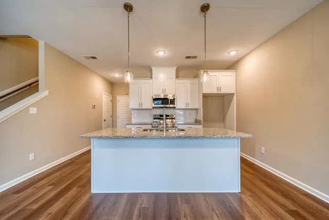 a view of kitchen with wooden floor