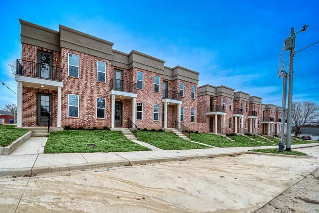 a front view of a building with garden