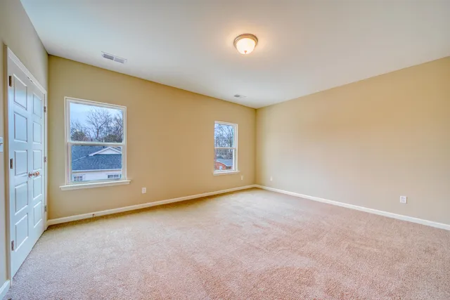 a bathroom with a granite countertop sink a toilet and bathtub