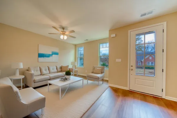 a living room with furniture and a window