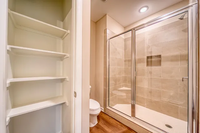 a bathroom with a granite countertop sink and a large mirror