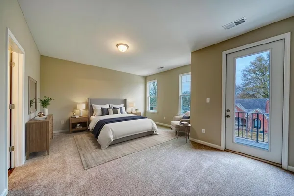 a bed room with a bed and a large window