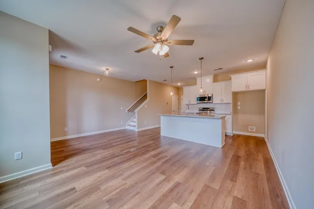 a view of a house with a large tree