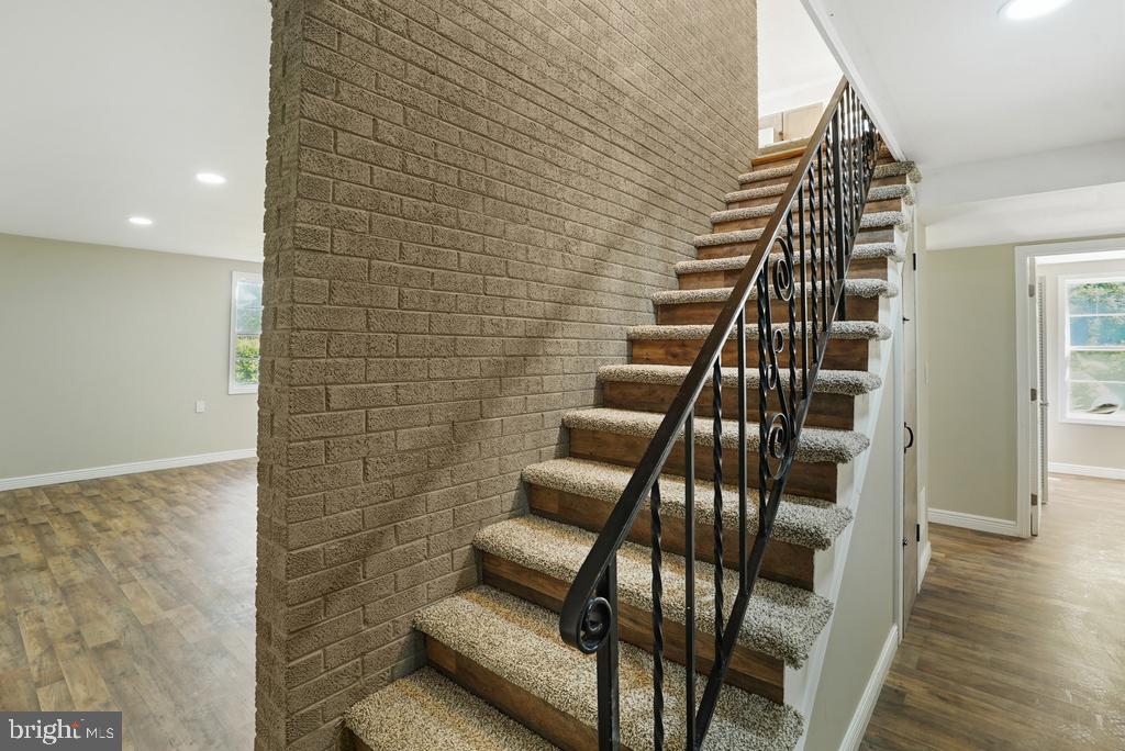 309 Cedar Ridge Drive Oxon Hill, MD 20745 - Photo 17 of 45 Inviting staircase with modern charm.