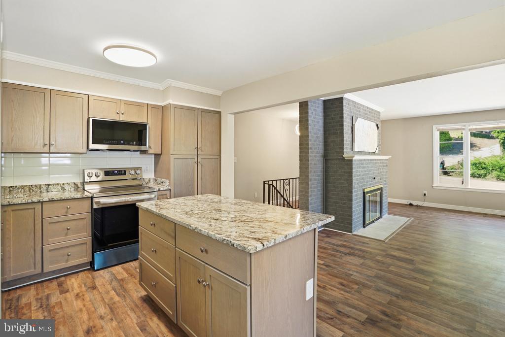 309 Cedar Ridge Drive Oxon Hill, MD 20745 - Photo 21 of 45 Modern kitchen with cozy living area.